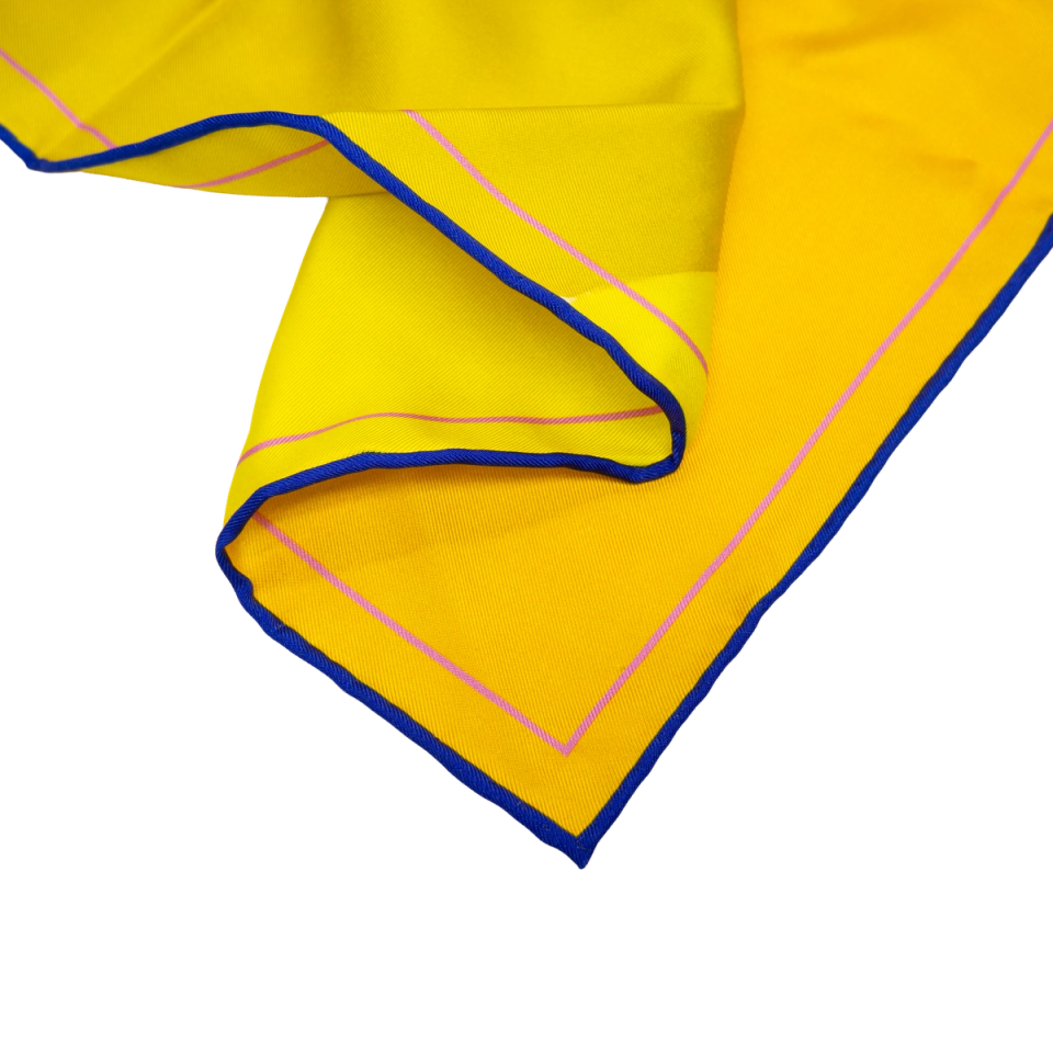 Corner detail of the Johs Rian scarf — yellow ground with blue and pink hand-rolled edge