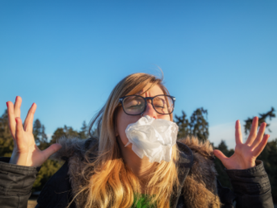 Female angry outside, tissue in face hands are up