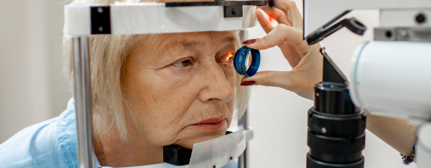 Medical professional conducting an eye exam on a patient 