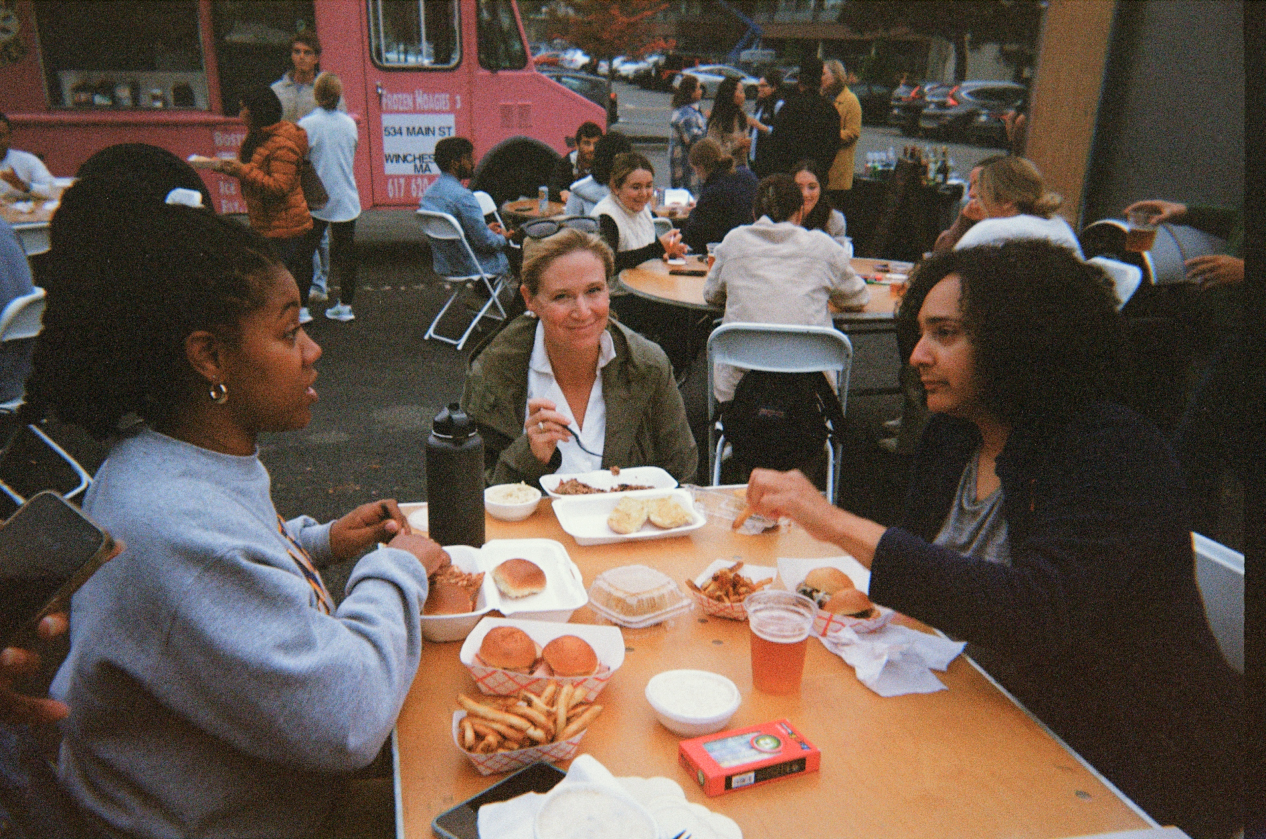 group of Firefly employees outside eating at a food truck event 