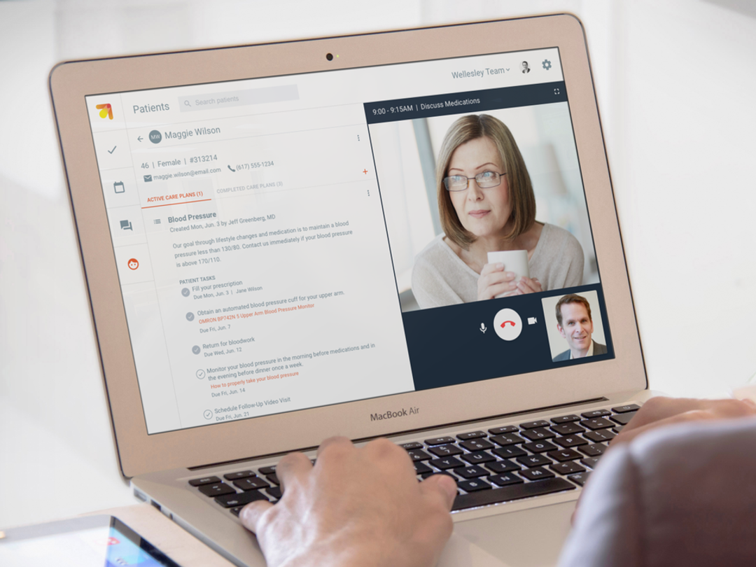 A laptop showing a virtual care moment between a patient and provider.