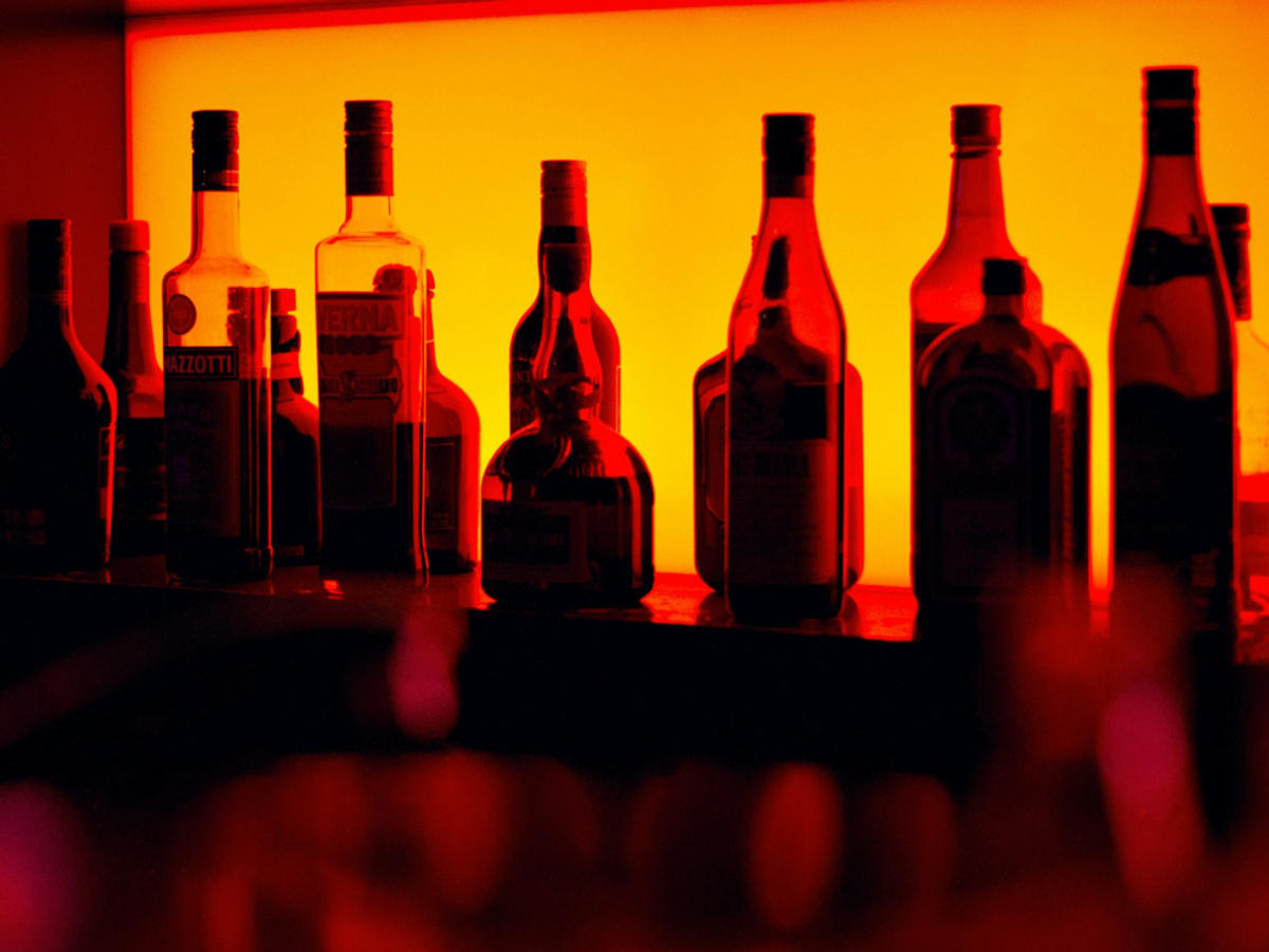colorful picture of liquor bottles on a shelf 