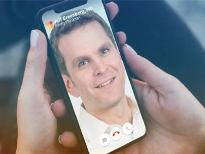 Image of a physician on a phone screen during an incoming call
