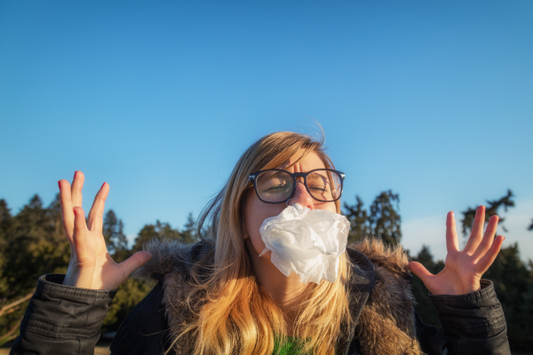 Female angry outside, tissue in face hands are up