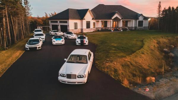 House showing off luxury car collection