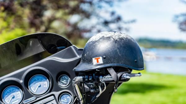 Motorcycle helmet resting on handlebars