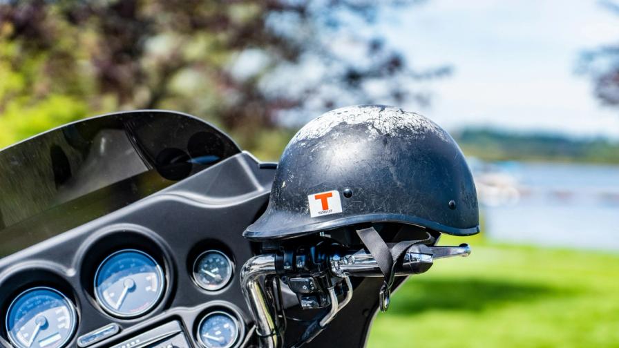 Motorcycle helmet resting on handlebars