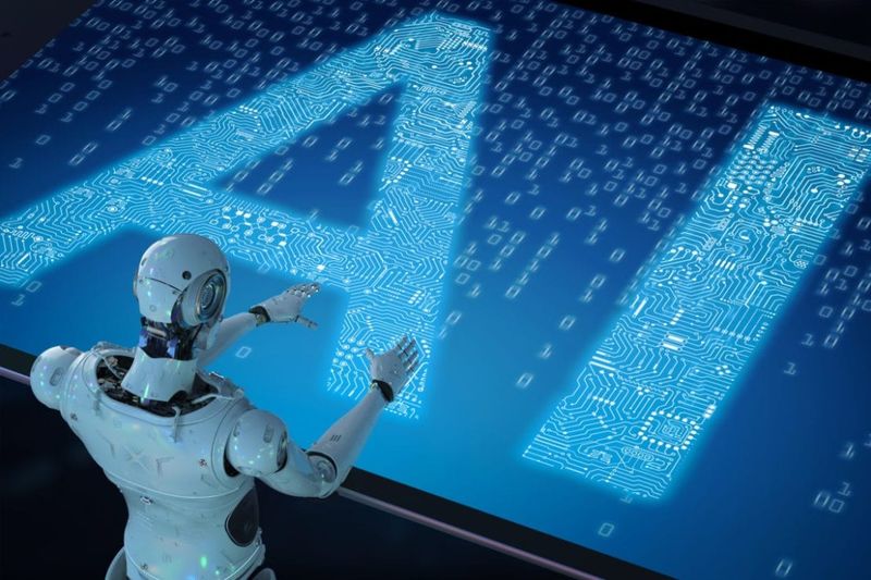 Illustration of a white humanoid robot reaching toward a glowing blue circuit-pattern screen displaying the letters "AI."