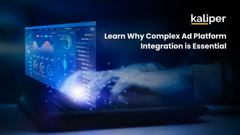 Blog header graphic titled "Learn Why Complex Ad Platform Integration is Essential," showing hands typing on a keyboard beside a glowing blue holographic analytics dashboard.