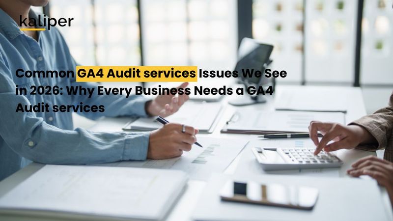 Blog header graphic titled "Common GA4 Audit services Issues We See in 2026," showing two people at a table reviewing printed reports with a calculator and tablet.