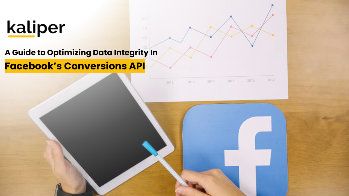Blog header graphic titled "A Guide to Optimizing Data Integrity In Facebook's Conversions API," showing a hand holding a tablet next to a printed line chart and a paper cutout of the Facebook logo on a desk.
