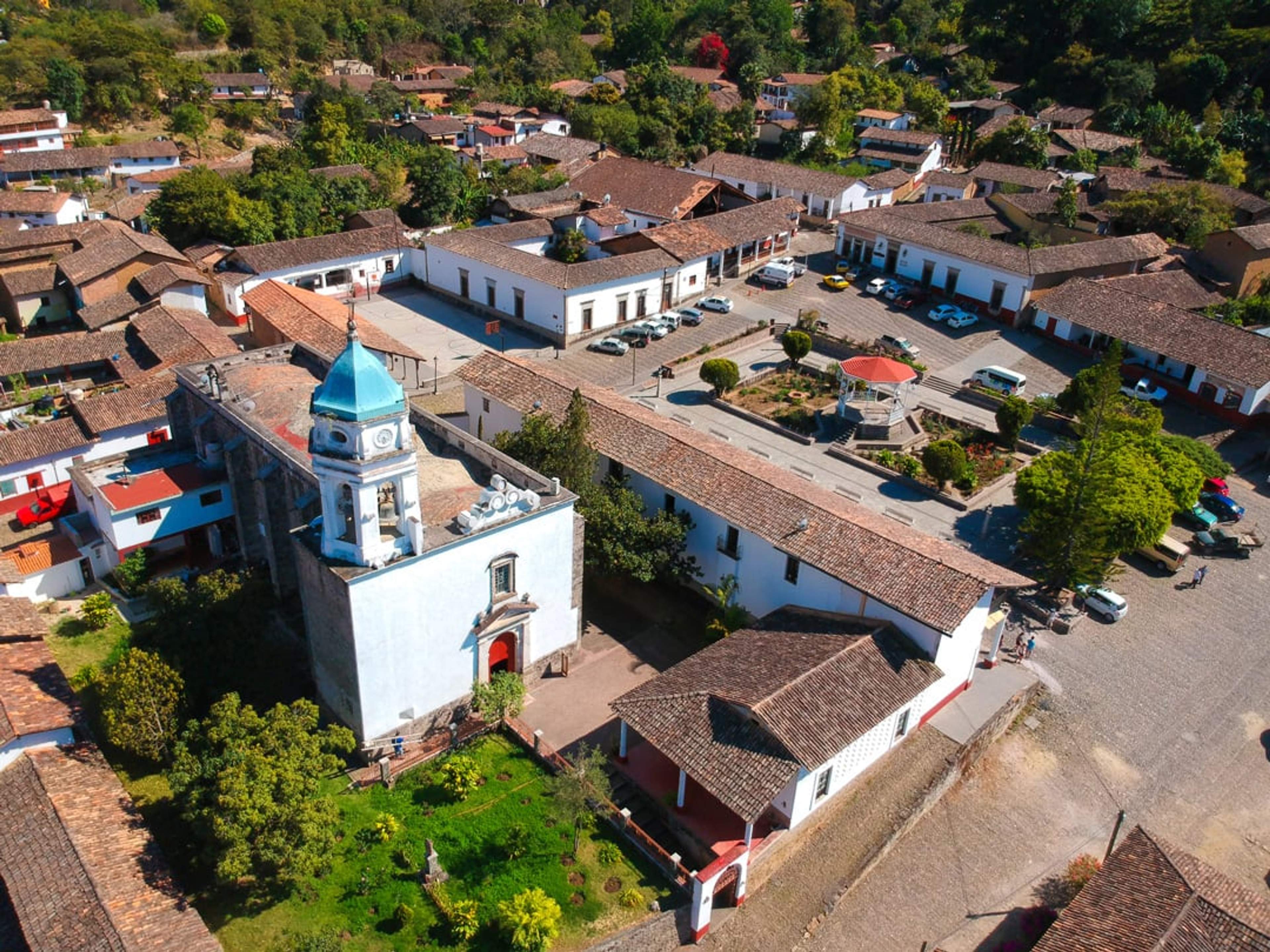 Aerial view of San Sebastián del Oeste, a historic town in the Sierra Madre mountains, showcasing its charming colonial architecture.
