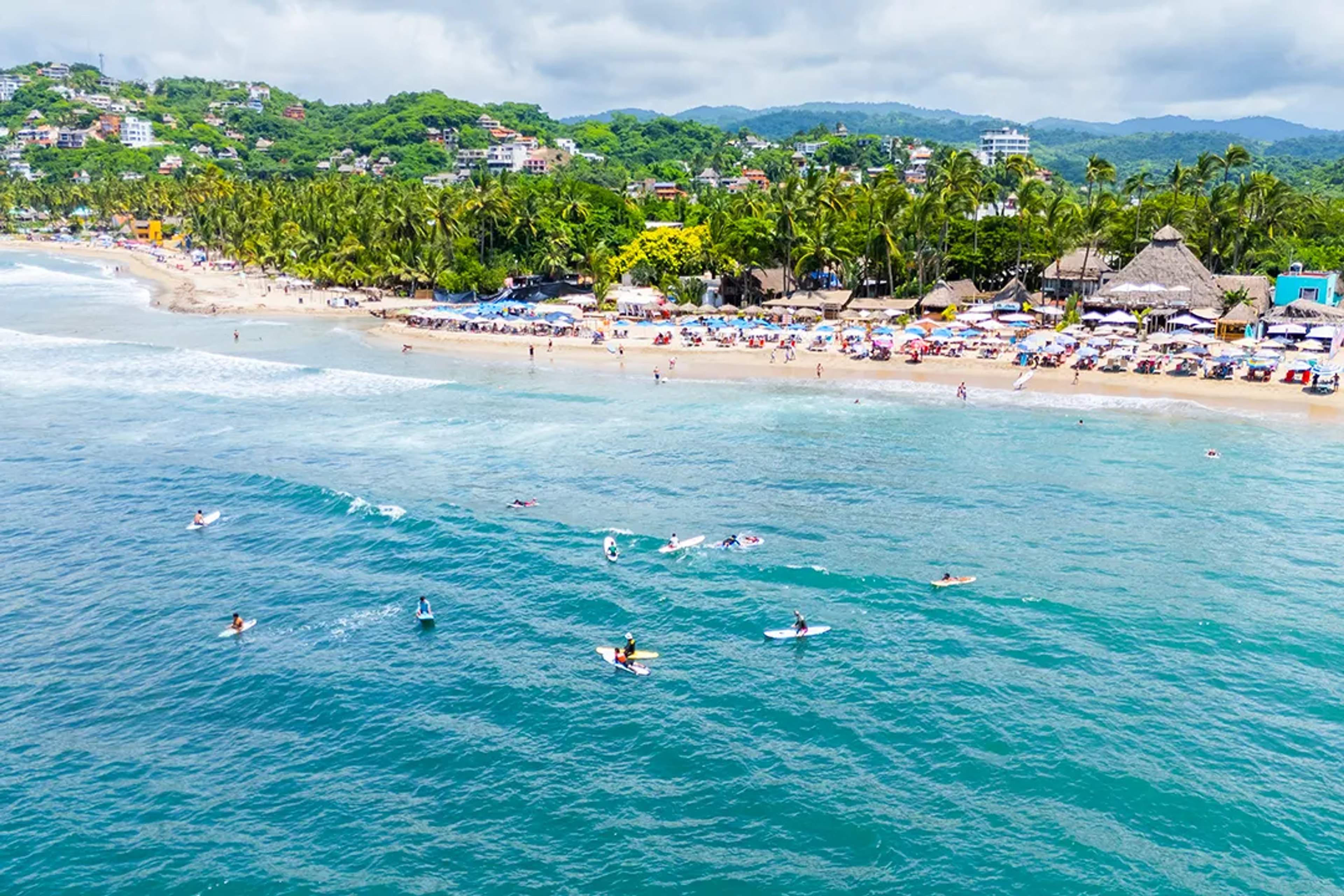 Surfing in Sayulita beach near Puerto Vallarta, perfect waves, vibrant town, and top surf tour experience