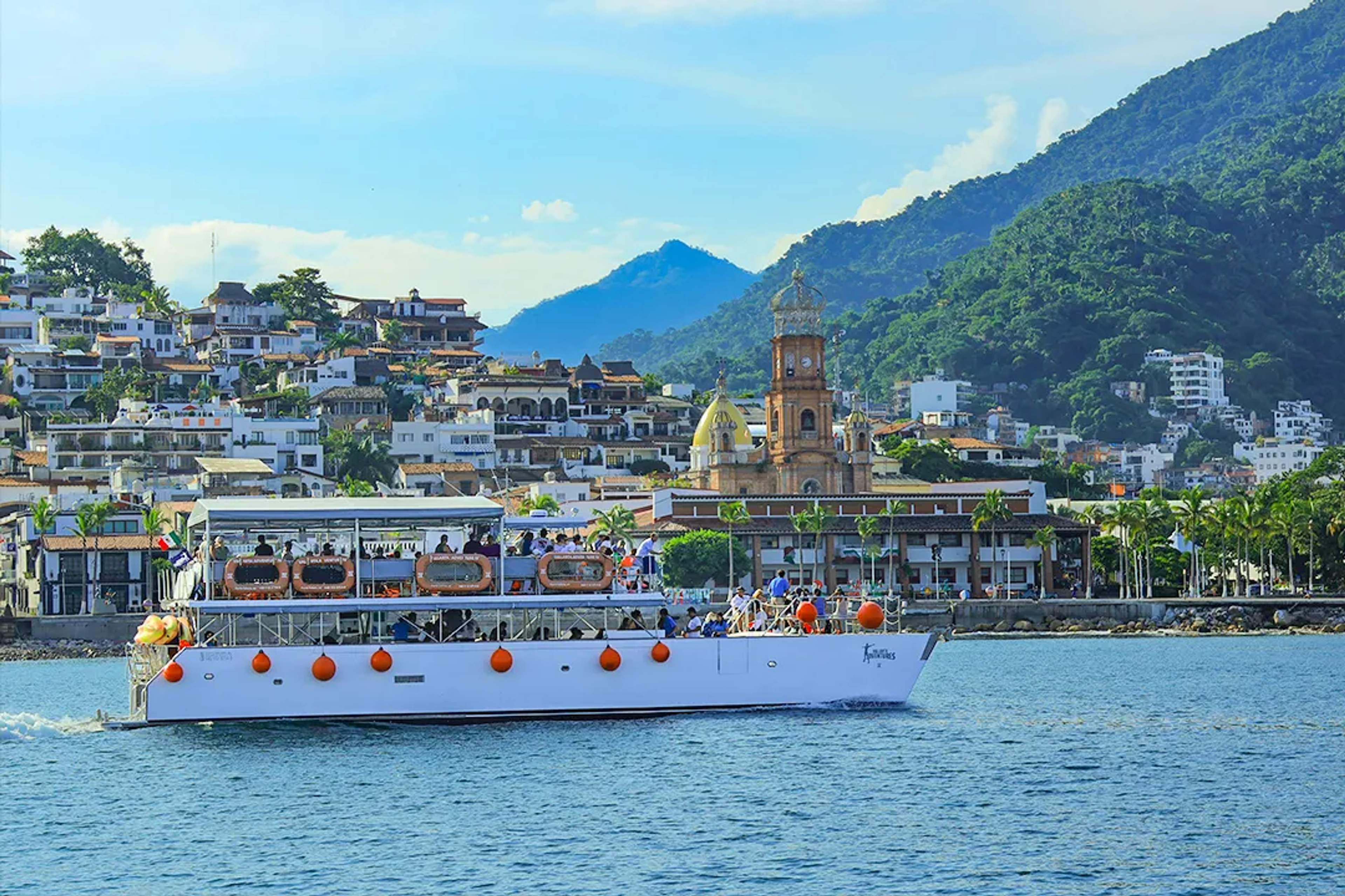 Family enjoying an off-road UTV adventure through jungle trails, river crossings on a guided tour in Puerto Vallarta, Mexico