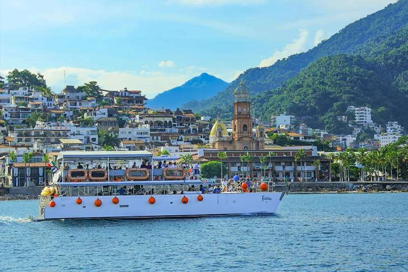 Family enjoying an off-road UTV adventure through jungle trails, river crossings on a guided tour in Puerto Vallarta, Mexico