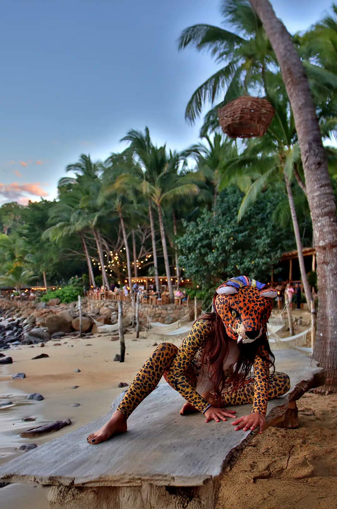 Performer in a jaguar costume posing at sunset during Rhythms of the Night in Puerto Vallarta.