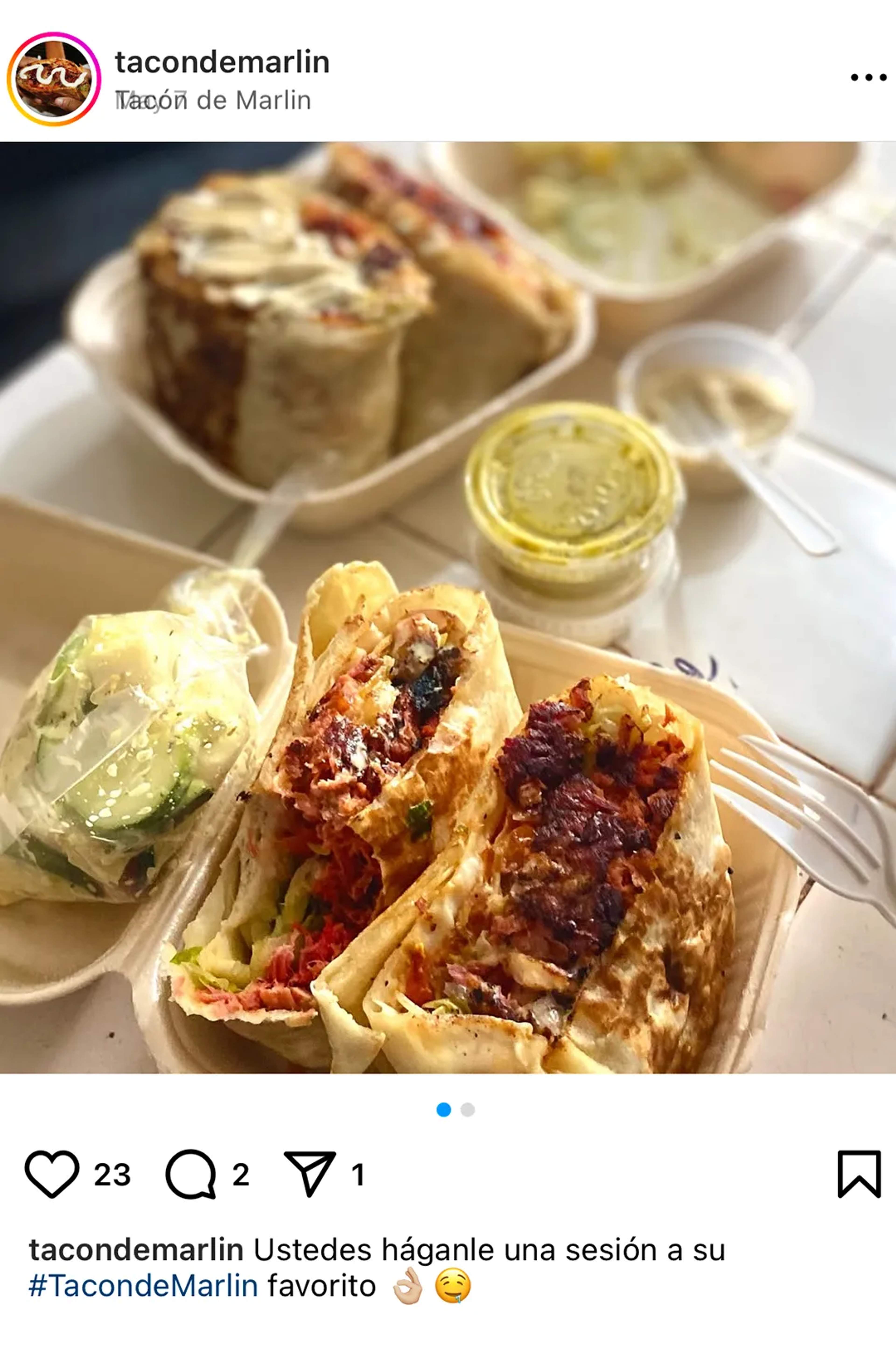 Delicious marlin tacos served with creamy sauces and cucumber salad on a takeout tray.