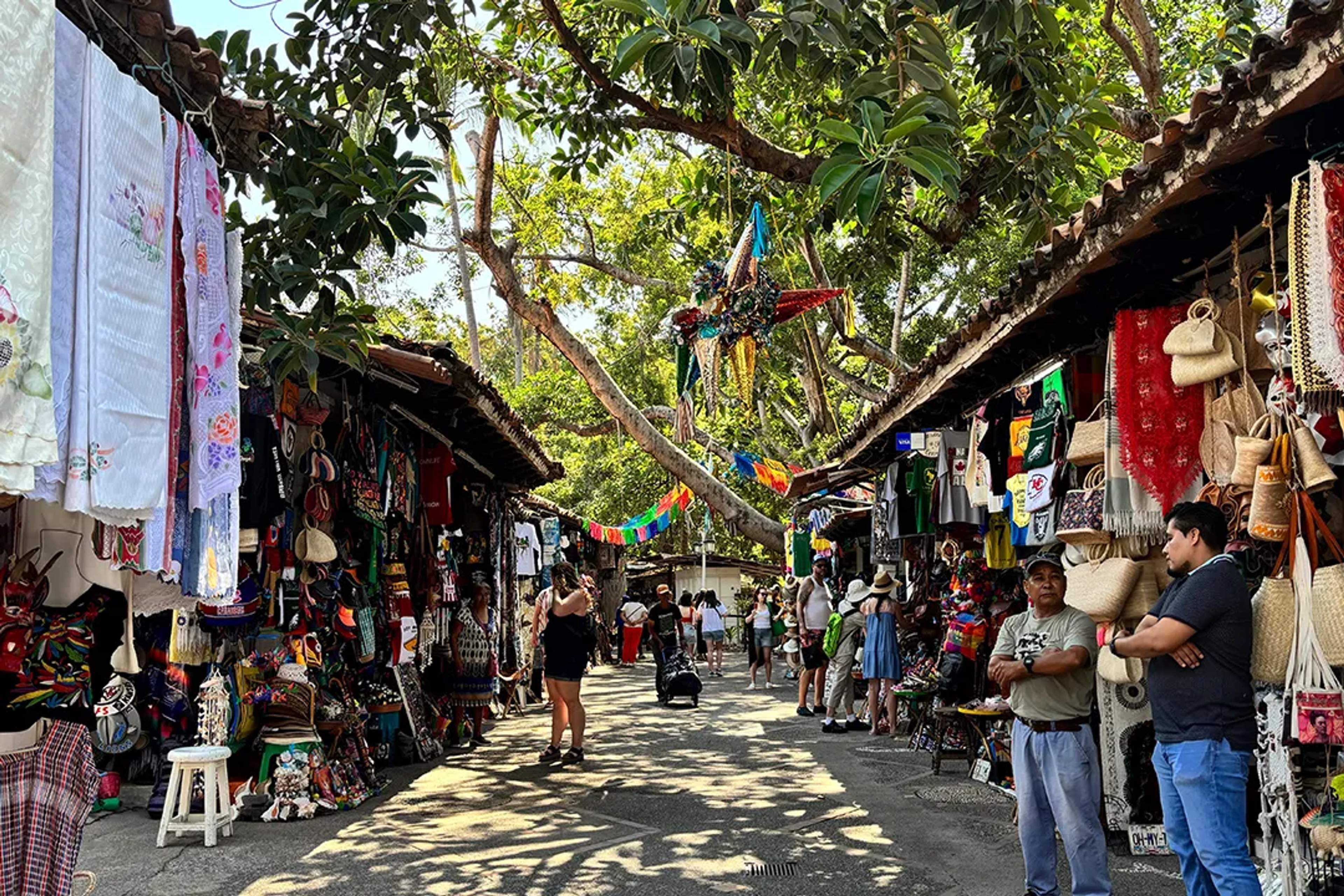 Cuale Island Market in Puerto Vallarta with colorful crafts, textiles, and local handmade art.