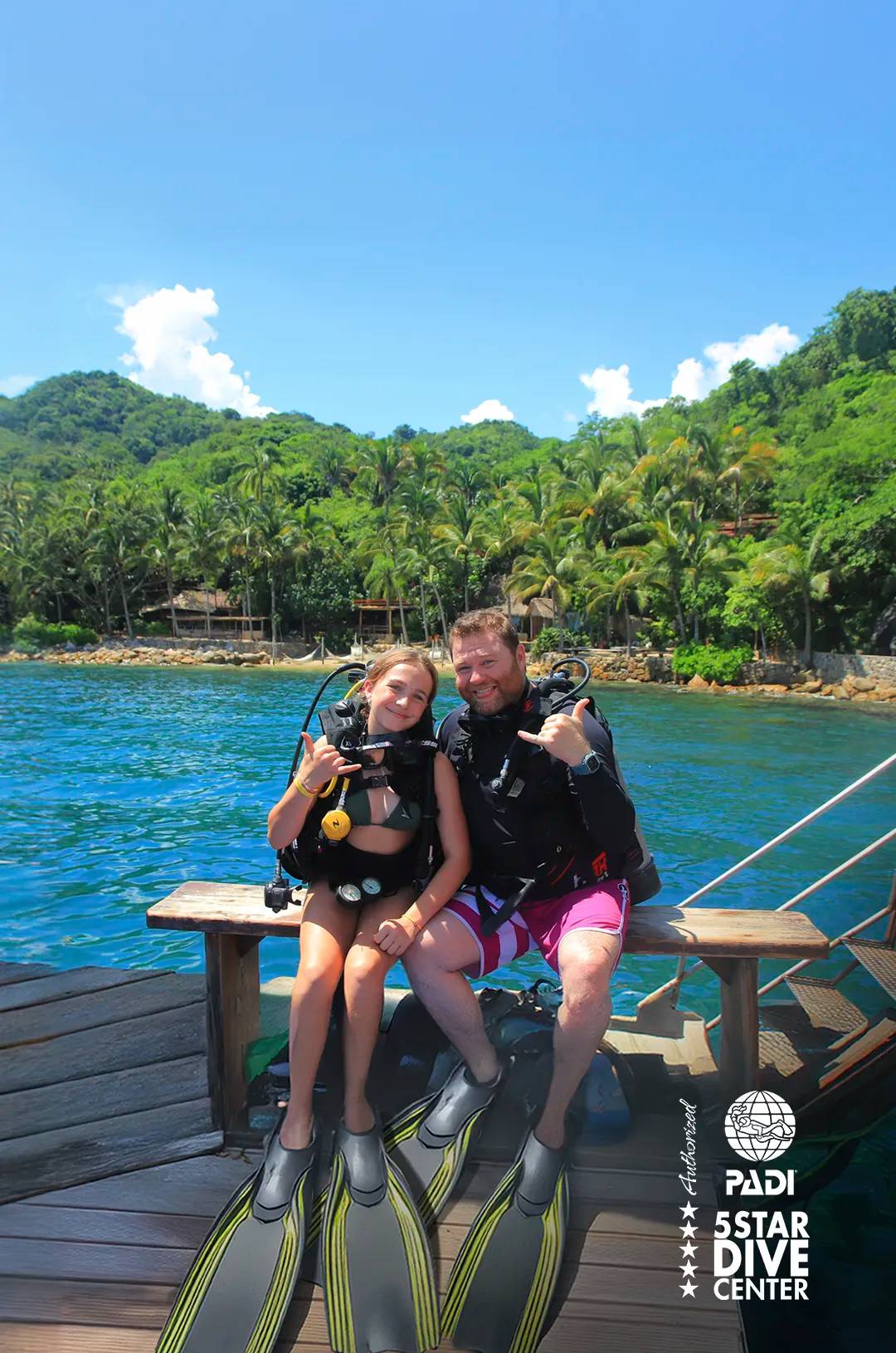 Two beginner scuba divers at Las Caletas for their first scuba diving lessons in Puerto Vallarta.