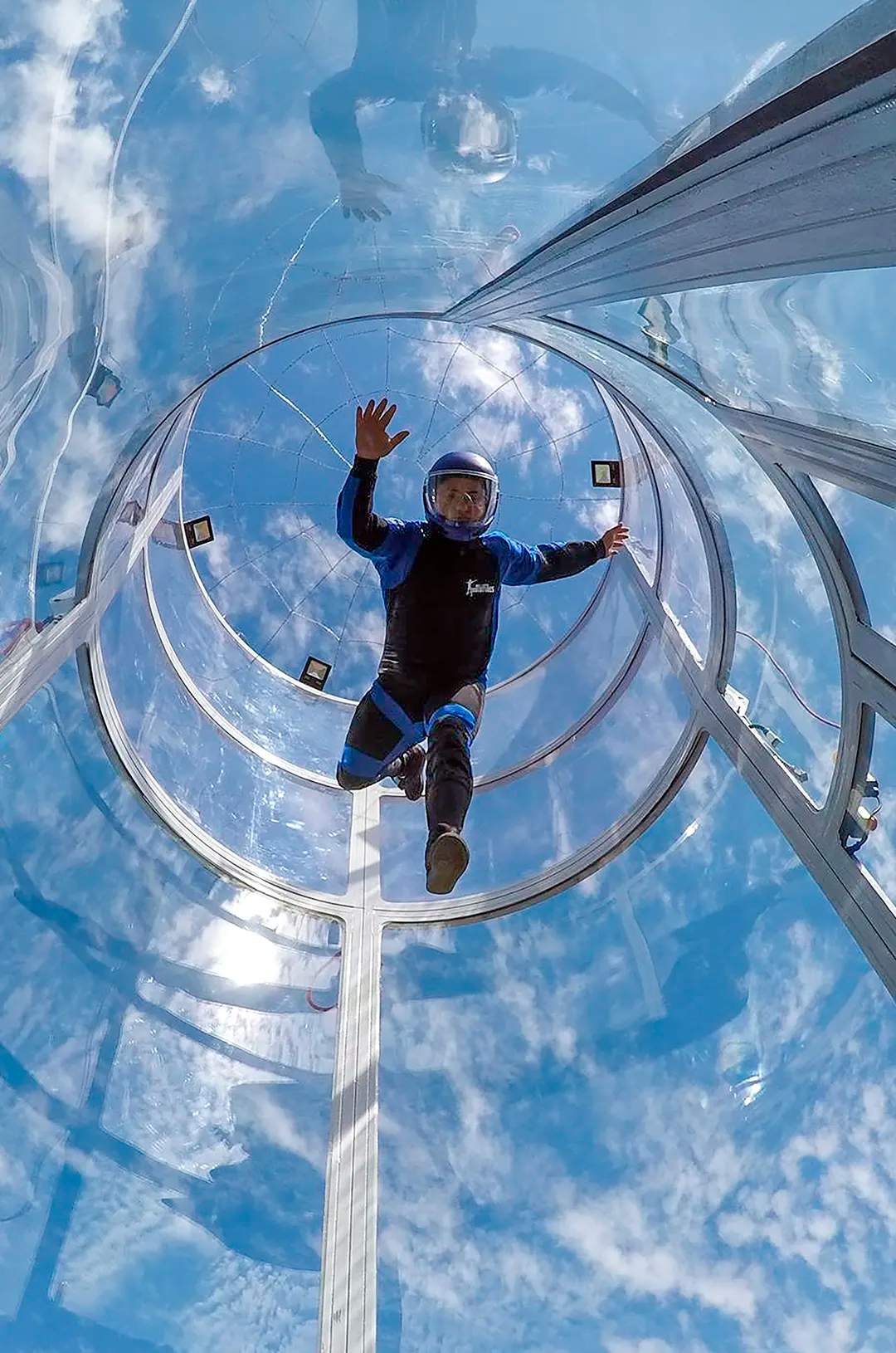 Young man flying in a thrilling skydiving simulator on the Extreme Adventure tour in Puerto Vallarta.