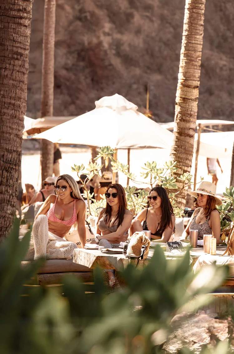 Group of friends at the most exclusive beach club in Puerto Vallarta.