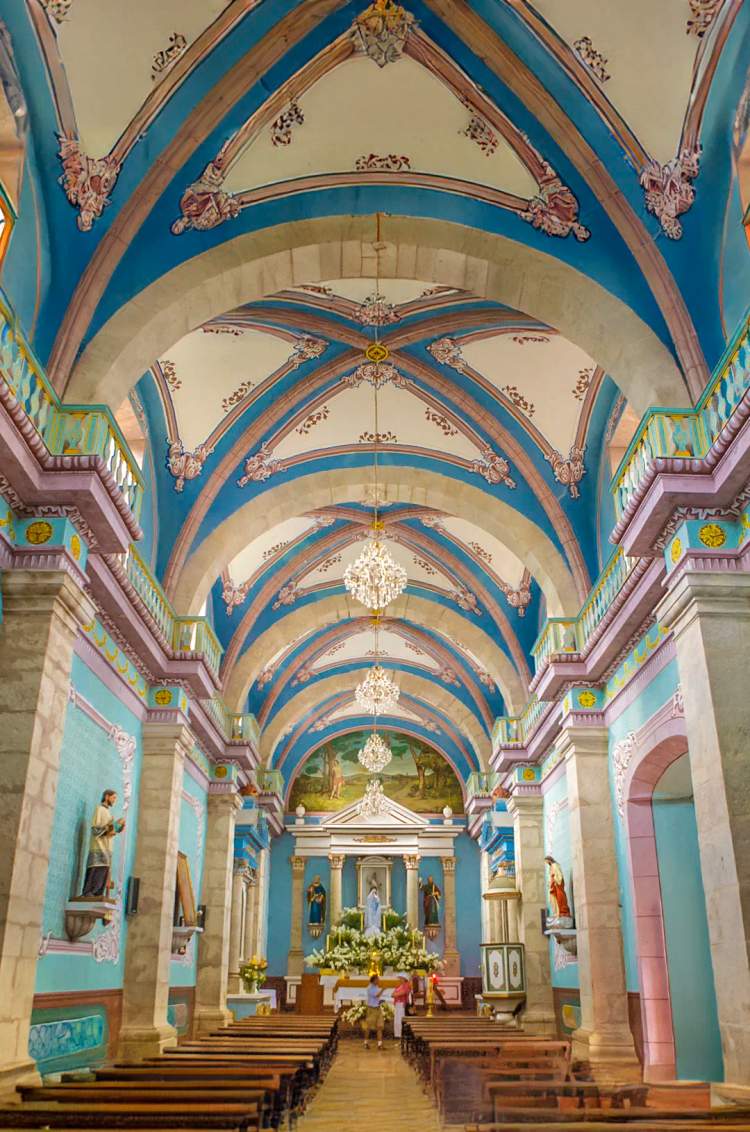 Vibrant interior of the historic church of San Sebastian del Oeste.