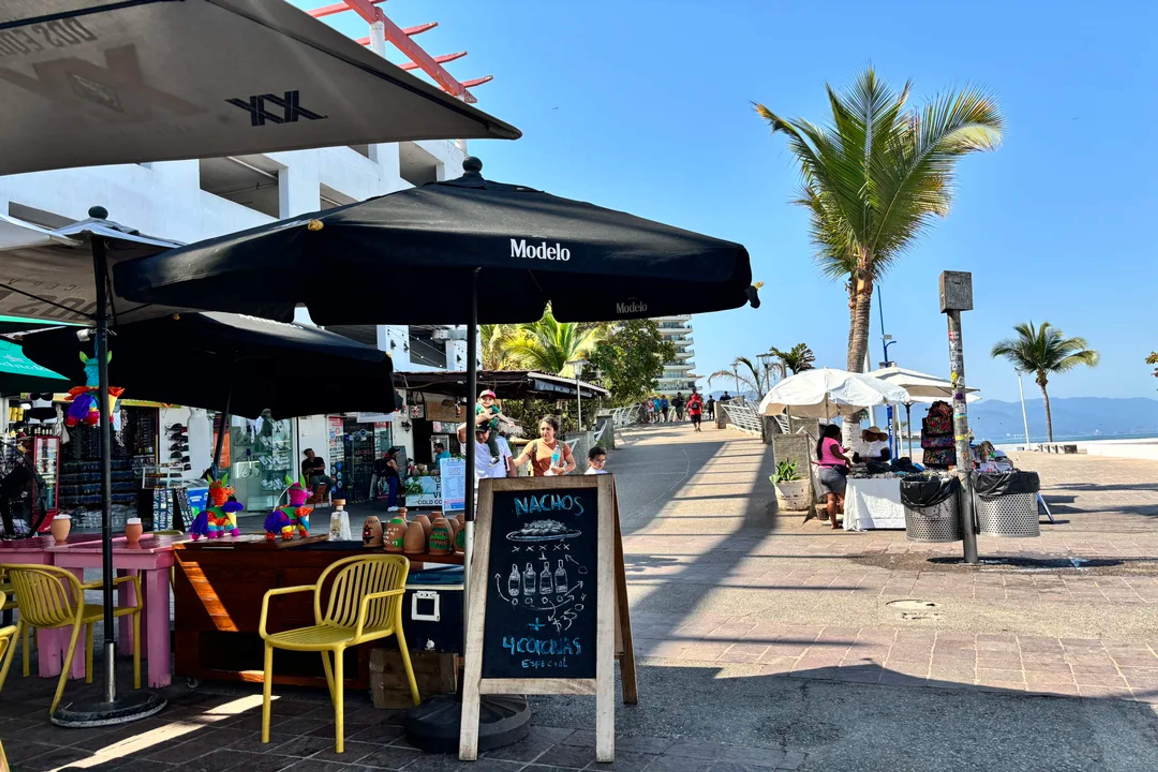 Street vendors and food stands liven up the Malecón in Puerto Vallarta on a sunny afternoon.