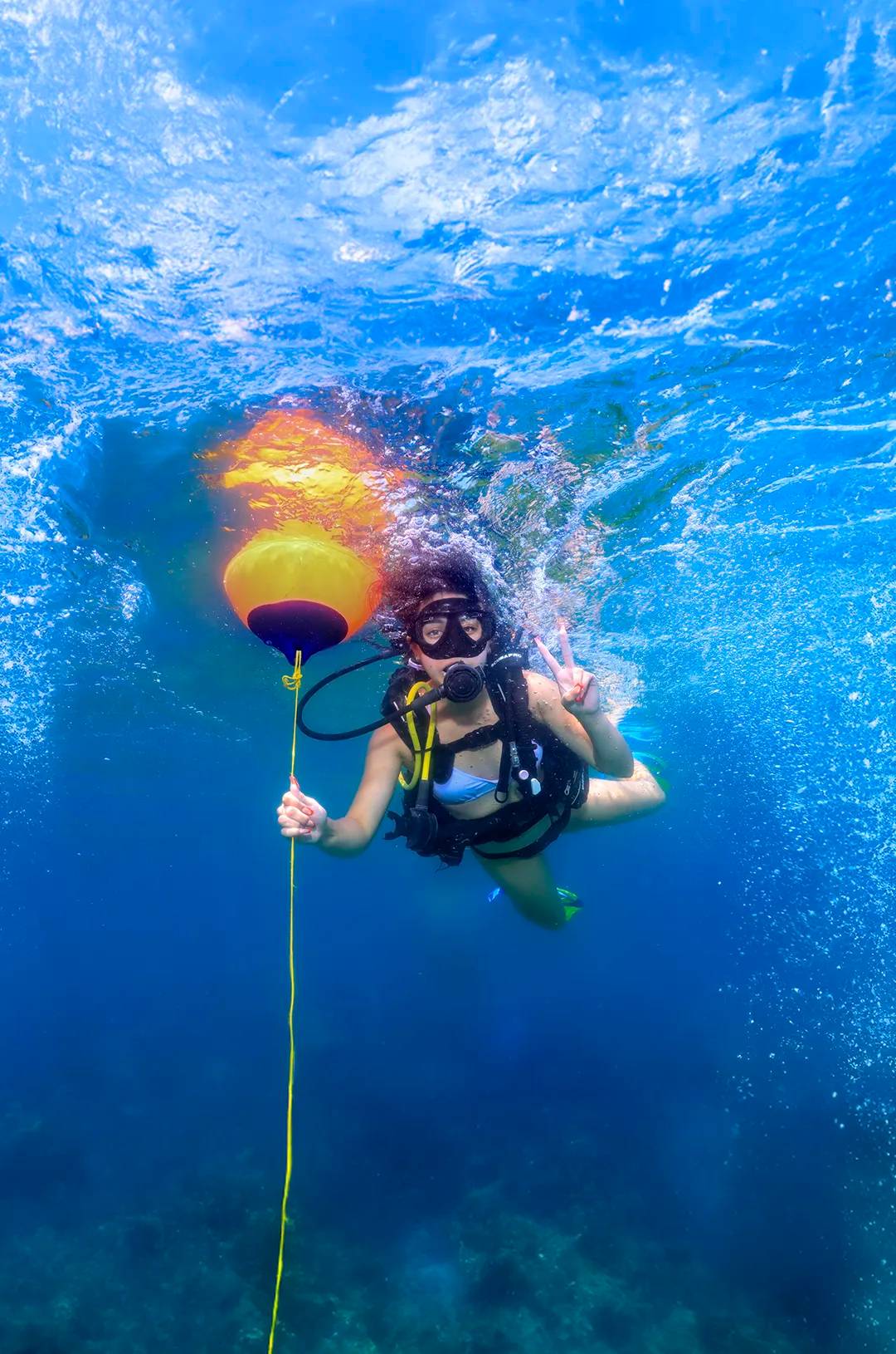 Girl in an introduction to scuba diving for beginners at Las Caletas Puerto Valalrta.