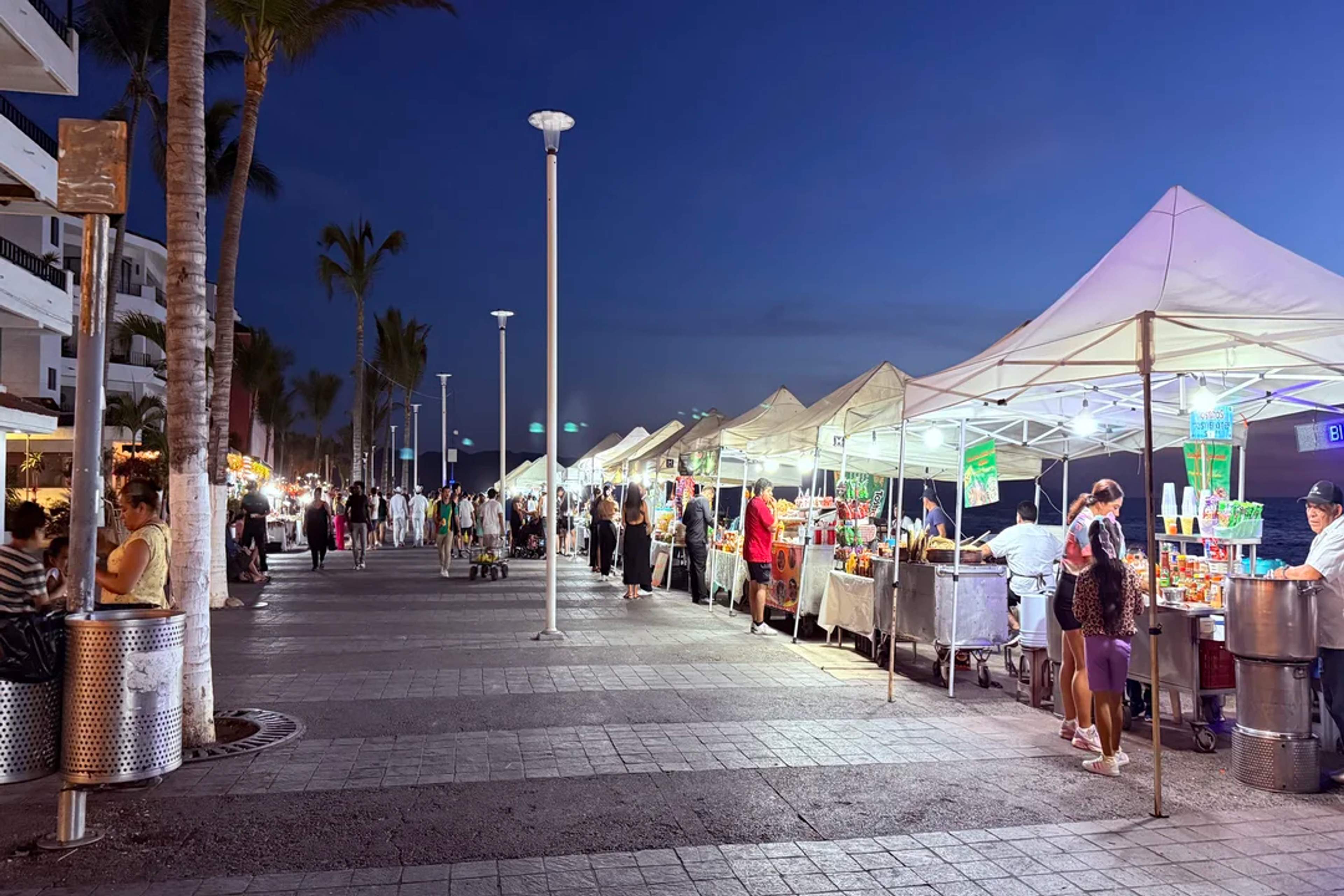 Evening market lights up the Puerto Vallarta boardwalk with food, crafts, and local charm.
