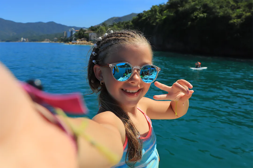 Kid having fun in a snorkeling tour in Puerto Vallarta