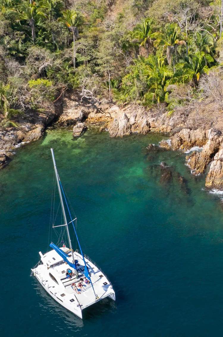 Sailing catamaran near Majahuitas during the best Puerto Vallarta snorkeling tour-