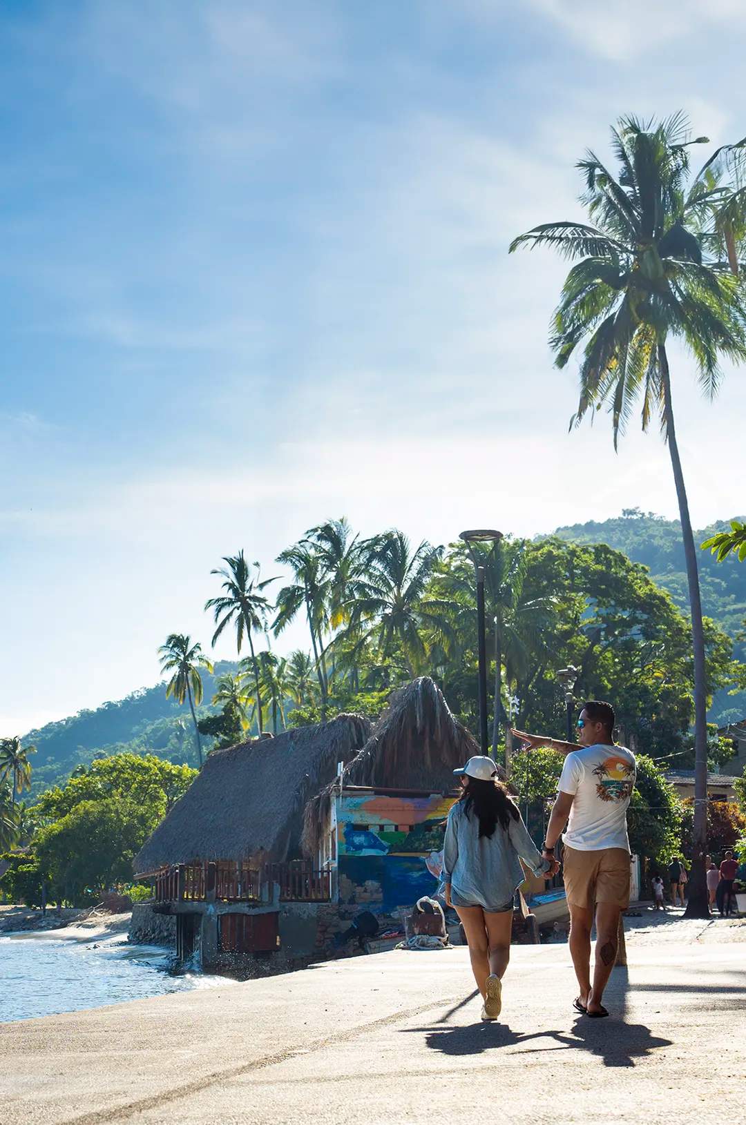 Travelers on a relaxed walking tour on coastal town close to Puerto Vallarta