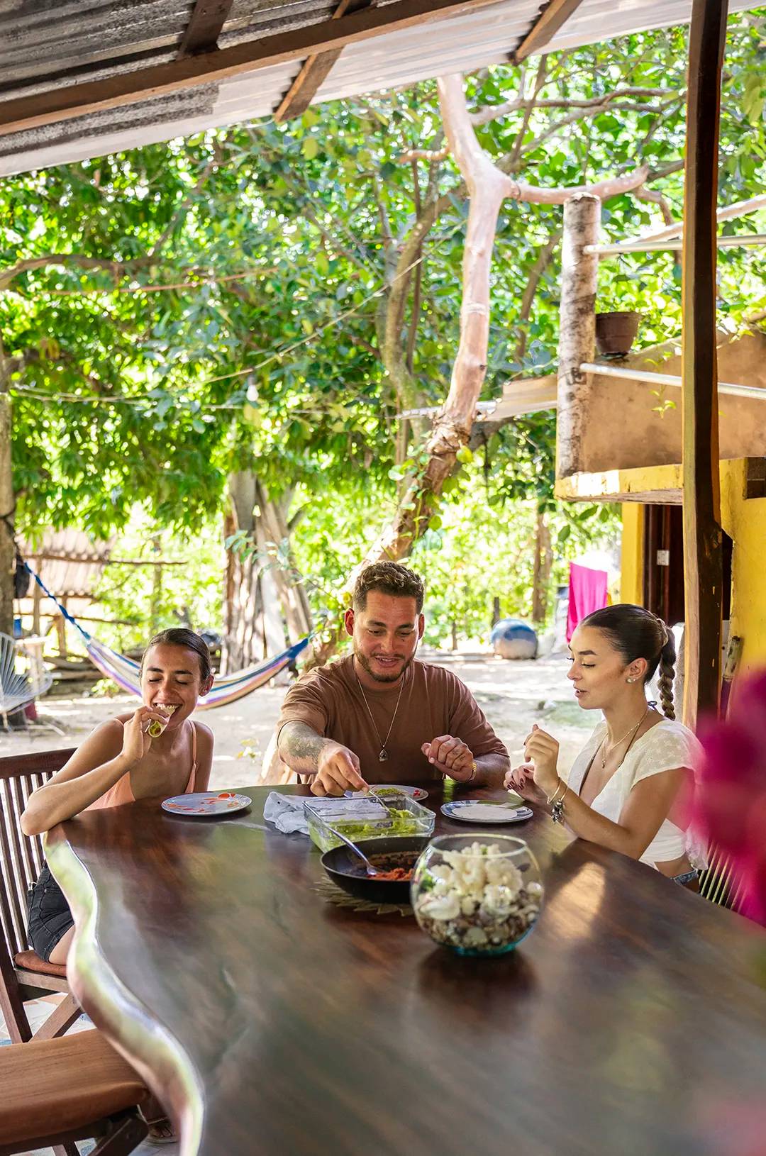 Friends enjoying tacos with hand-made tortillas during a Puerto Vallarta tour. 