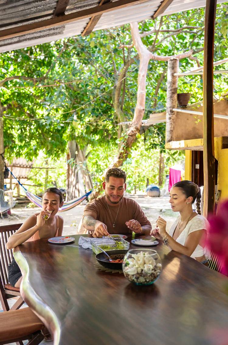 Friends enjoying tacos with hand-made tortillas during a Puerto Vallarta tour.