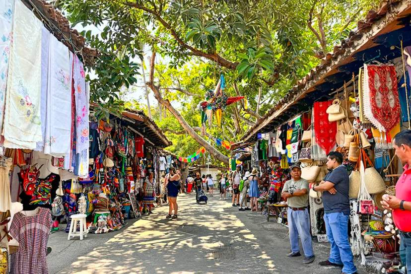 Colorful Puerto Vallarta market with handmade crafts, textiles, and souvenirs in a vibrant outdoor setting
