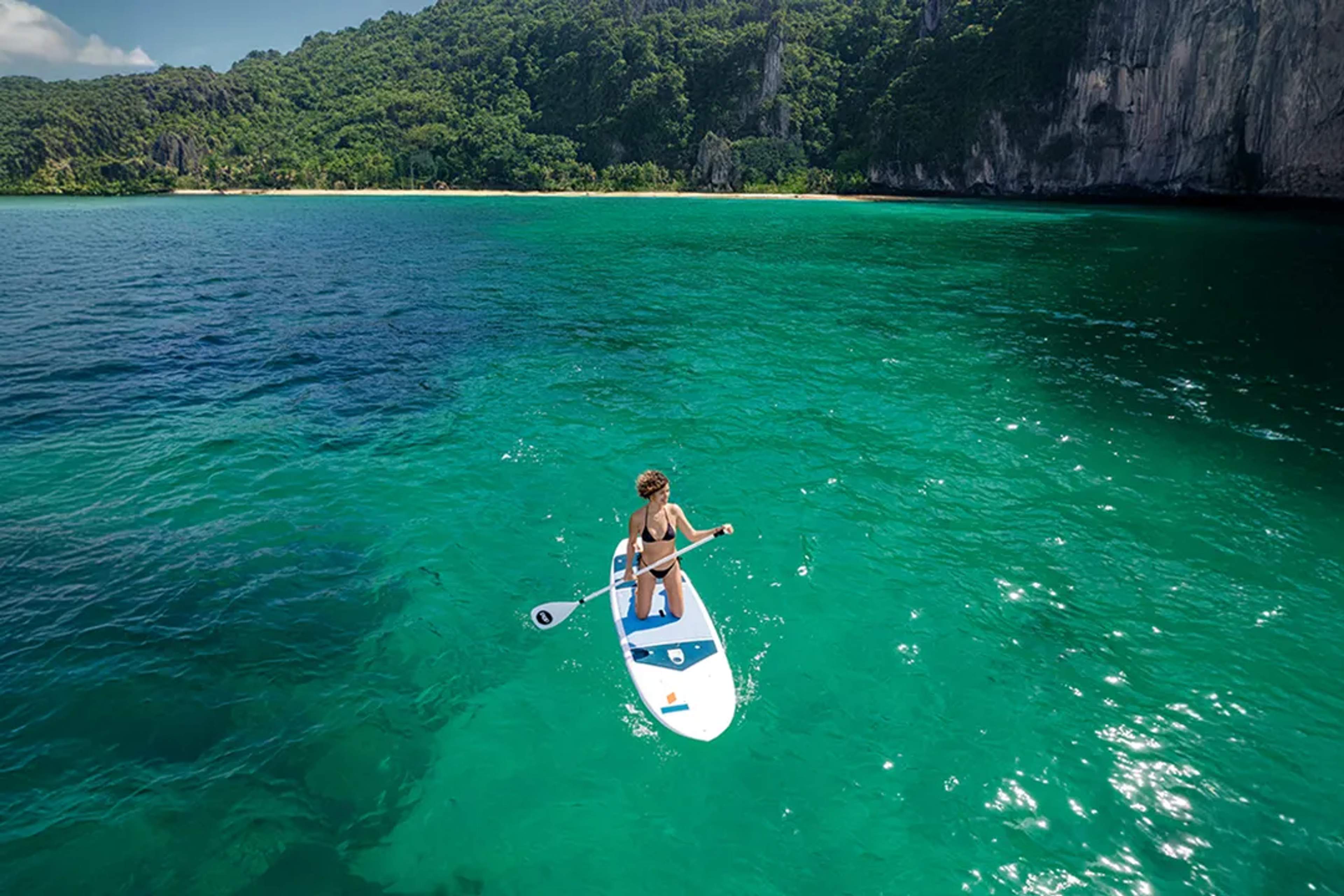 Paddle board tour in Puerto Vallarta with crystal clear waters and jungle coastline views at Las Caletas