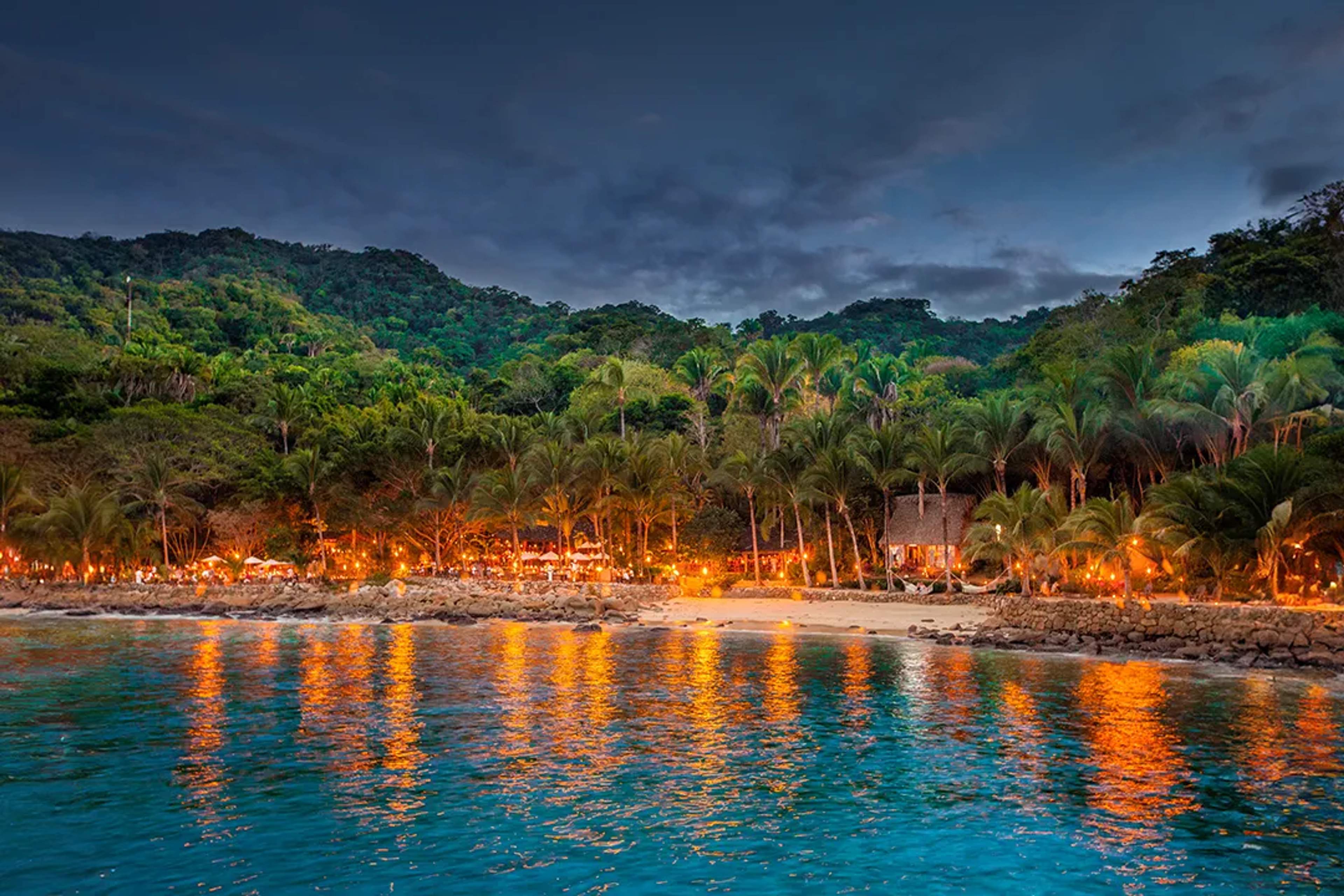 Rhythms of the Night at Las Caletas beach with candlelit dinner, jungle show and oceanfront views