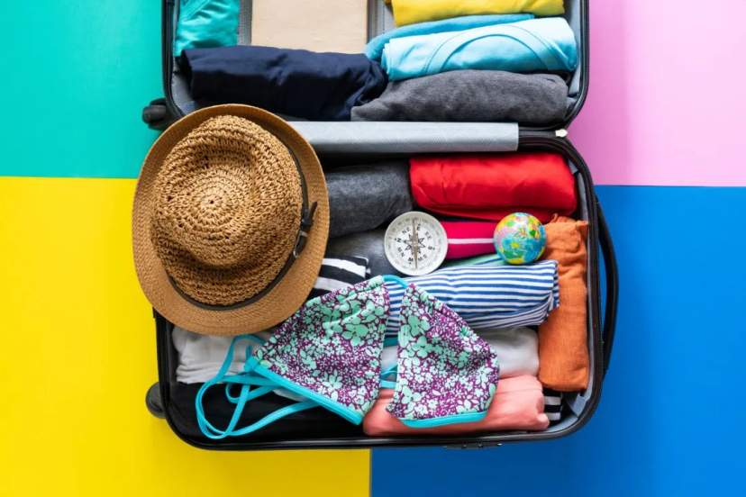 Open suitcase filled with clothes.