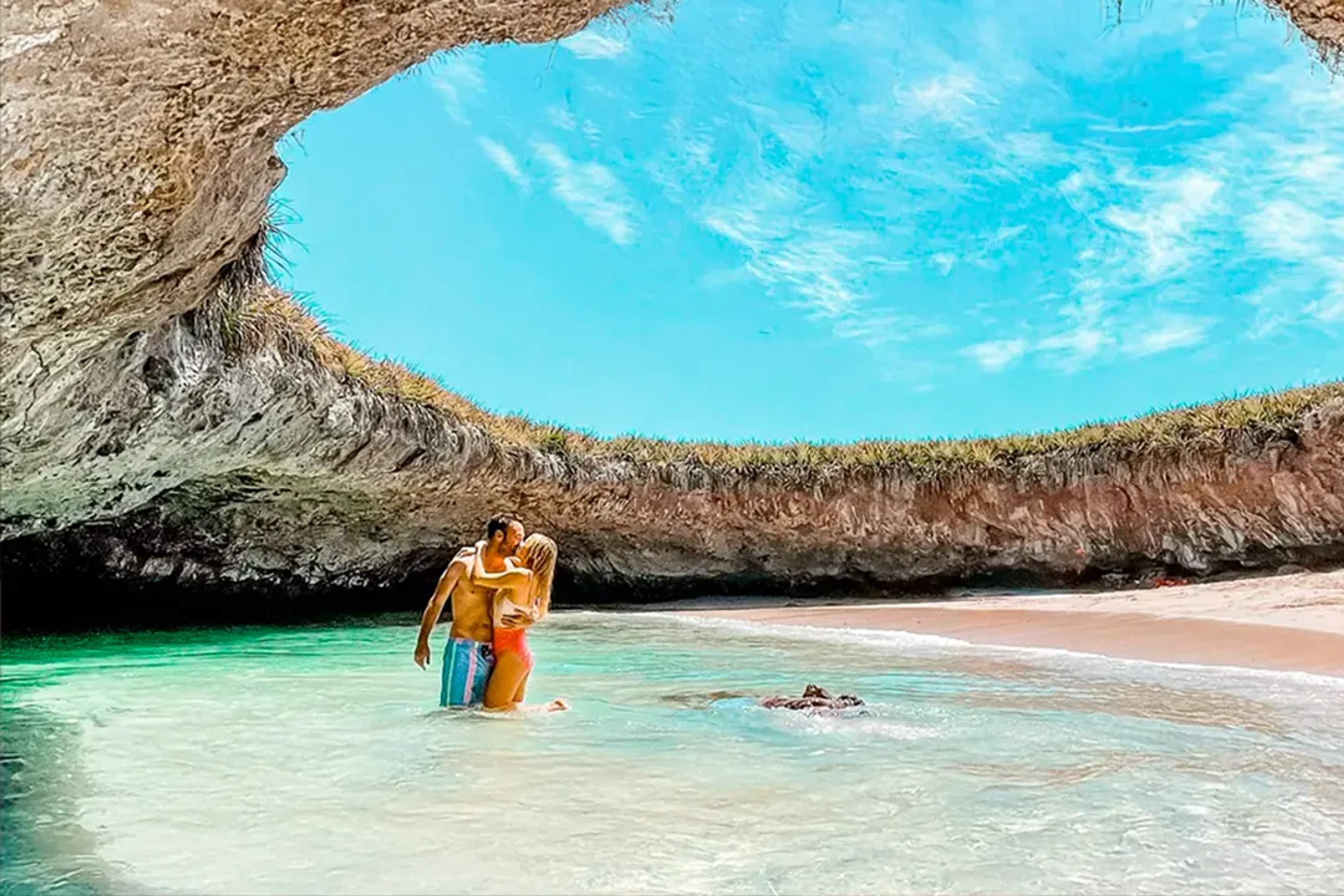 Couple enjoying the iconic Hidden Beach at Marietas Islands, a romantic natural wonder near Puerto Vallarta
