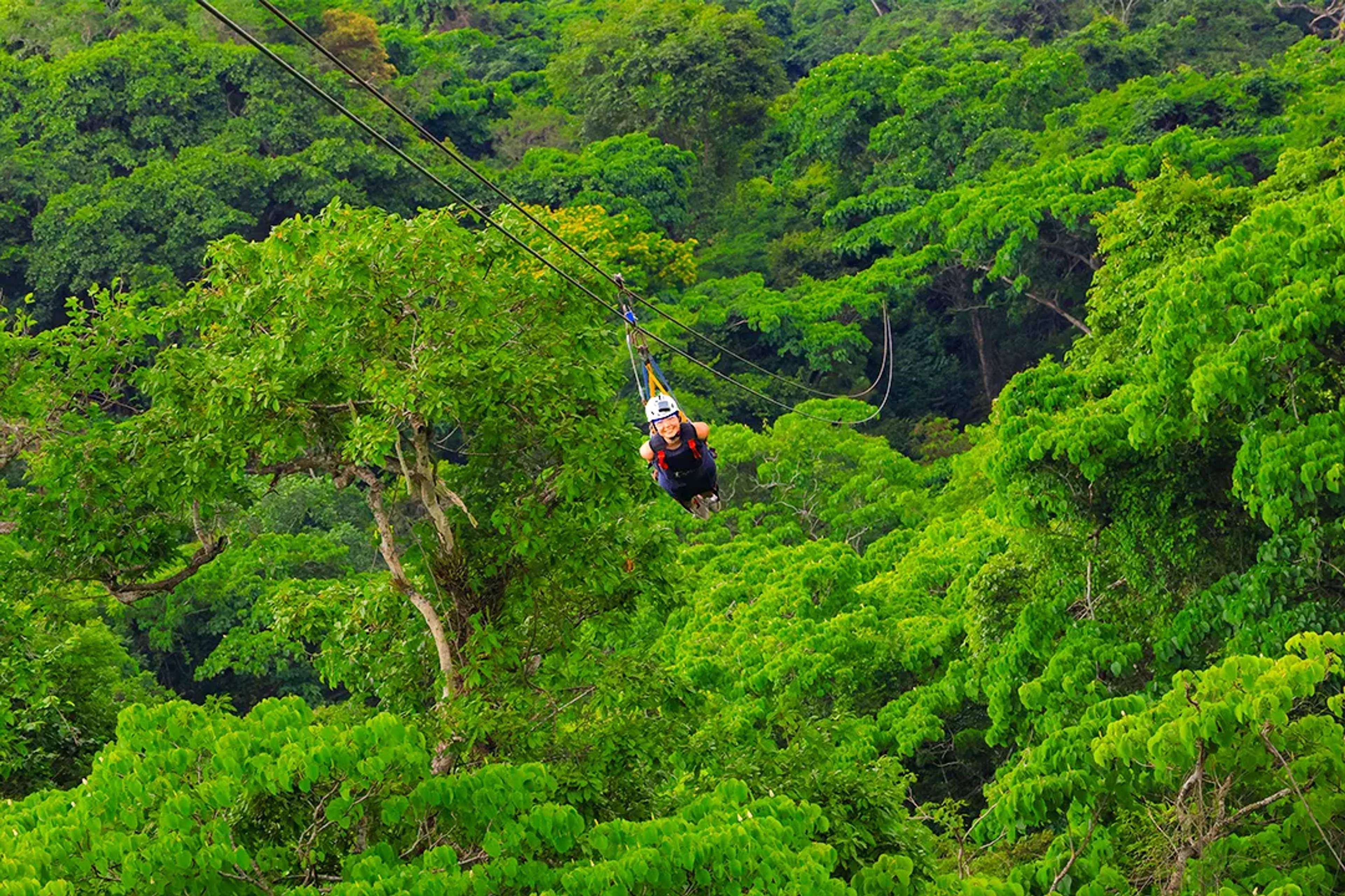 Superman-style zip line over Puerto Vallarta jungle on Outdoor Adventure tour above Sierra Madre rainforest canopy