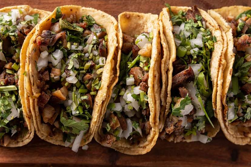 Authentic Mexican street tacos with grilled meat, cilantro, onion, and corn tortillas, a classic Puerto Vallarta favorite.