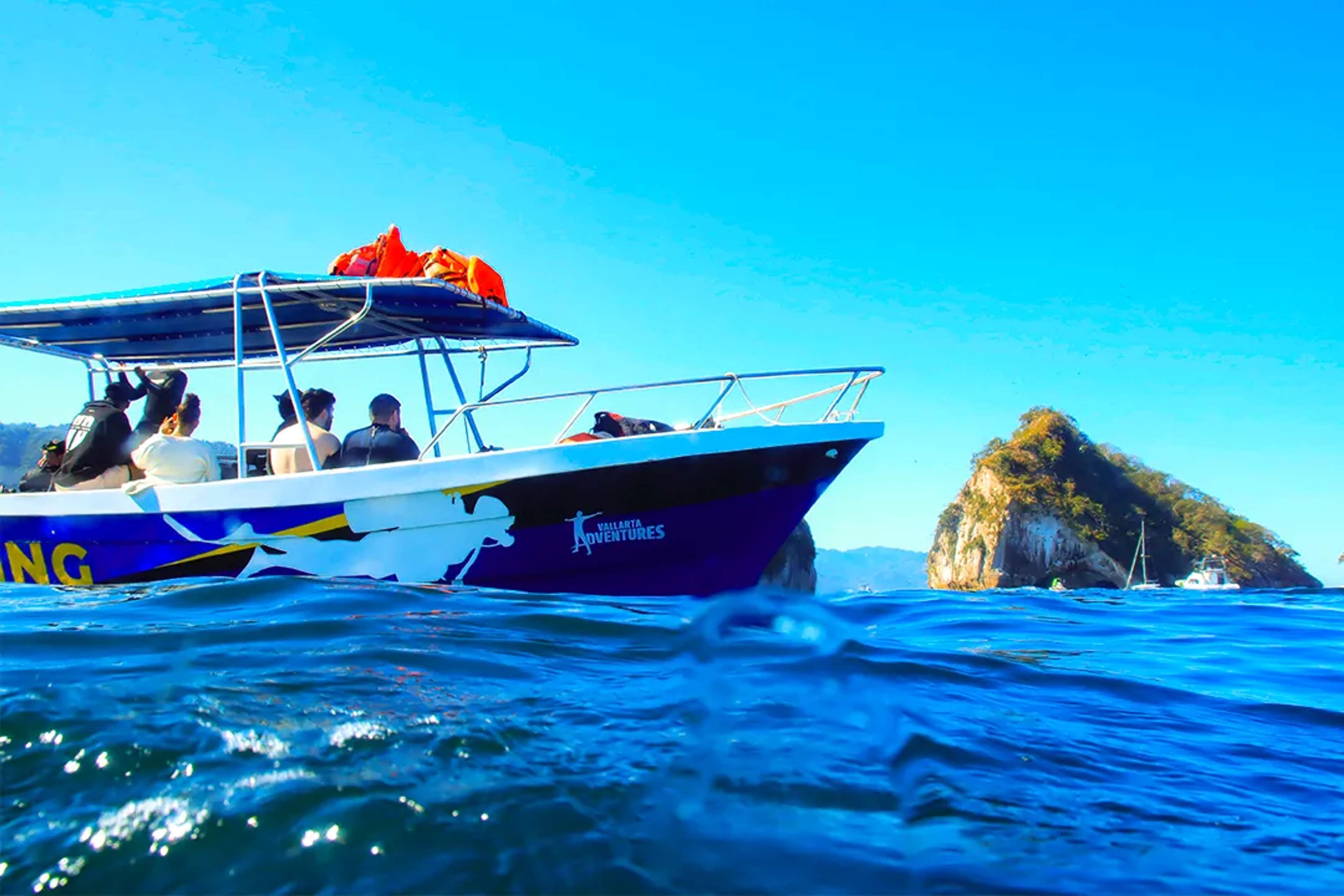 Boat tour at Los Arcos Marine Park in Puerto Vallarta, crystal-clear waters and iconic rock formations