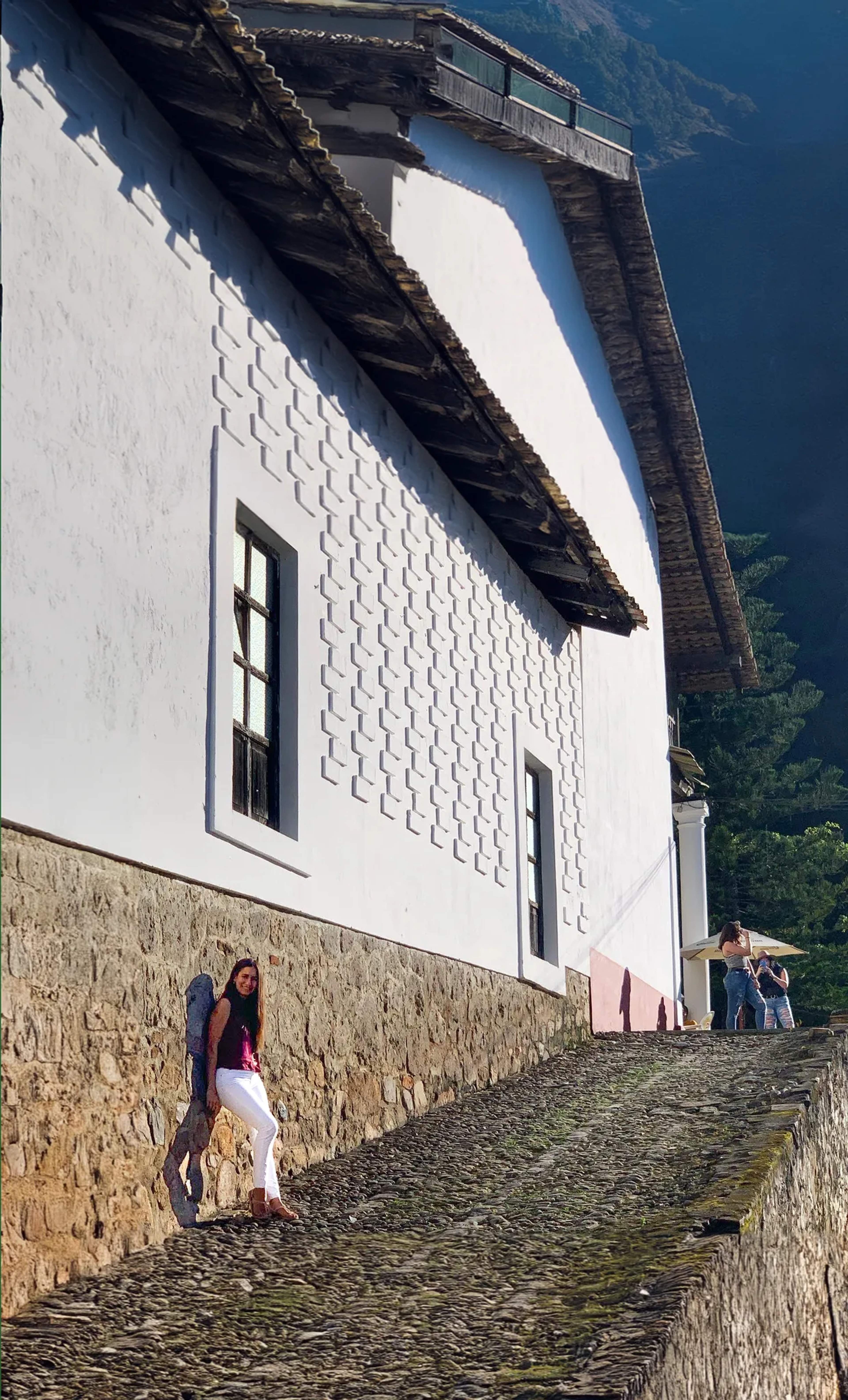Visitors stroll the white-walled cobblestone streets of San Sebastián del Oeste, a well-preserved colonial mountain village