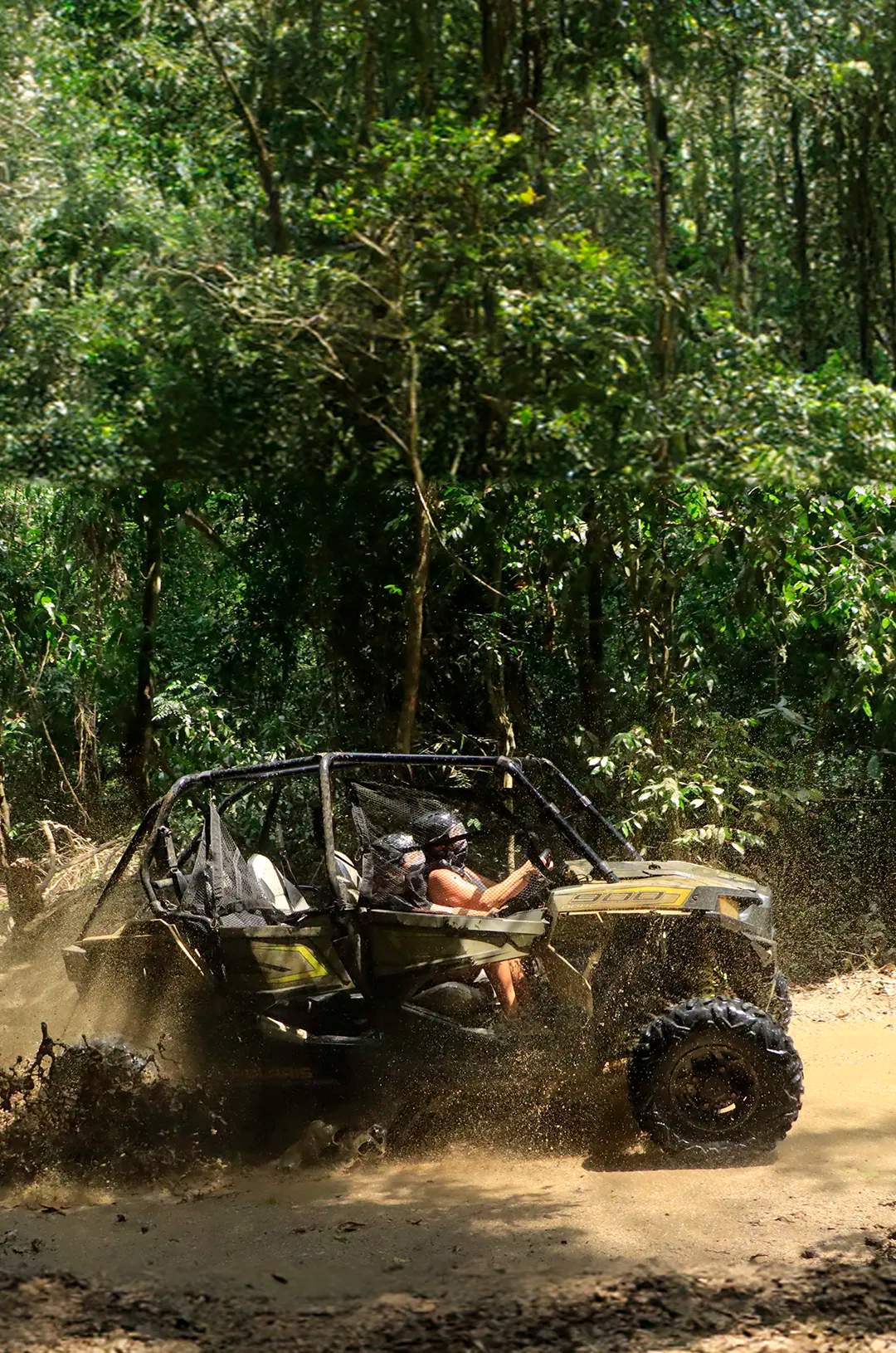 An ATV through a muddy trail in a forest during a Puerto Vallarta off-road tour.