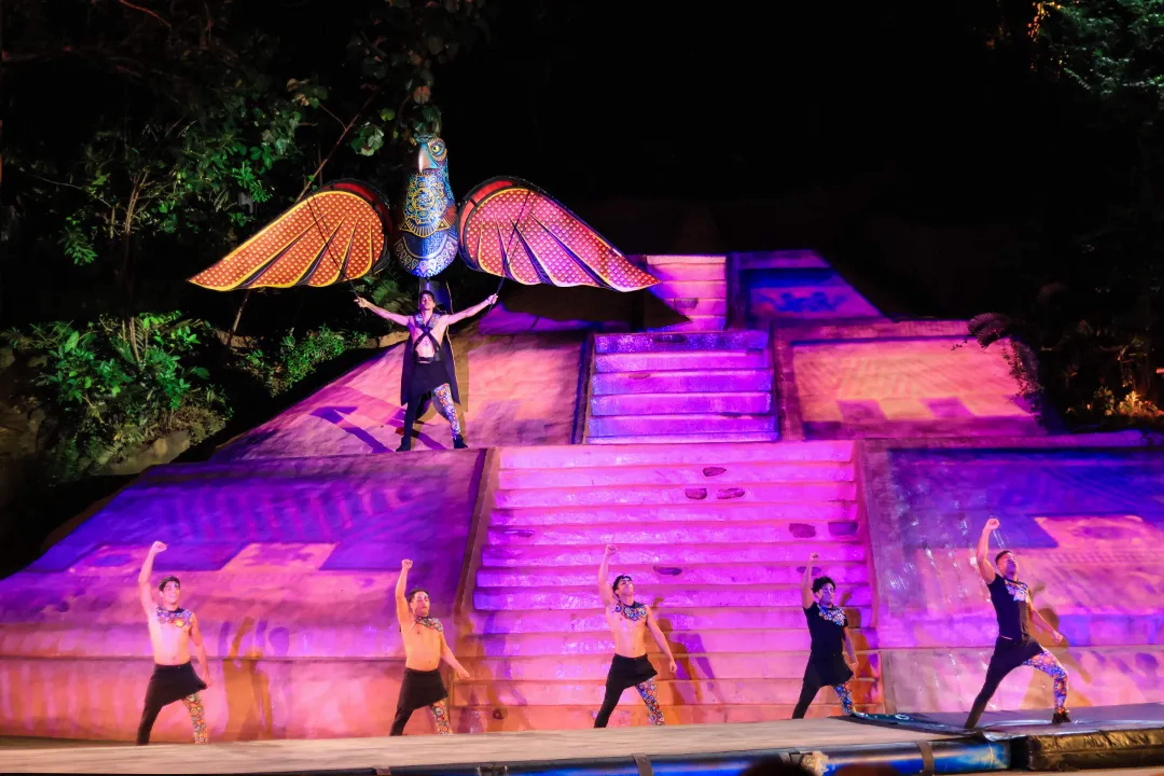 Colorful bird-spirit scene from ALMA, Rhythms of the Night show in Puerto Vallarta’s jungle amphitheater