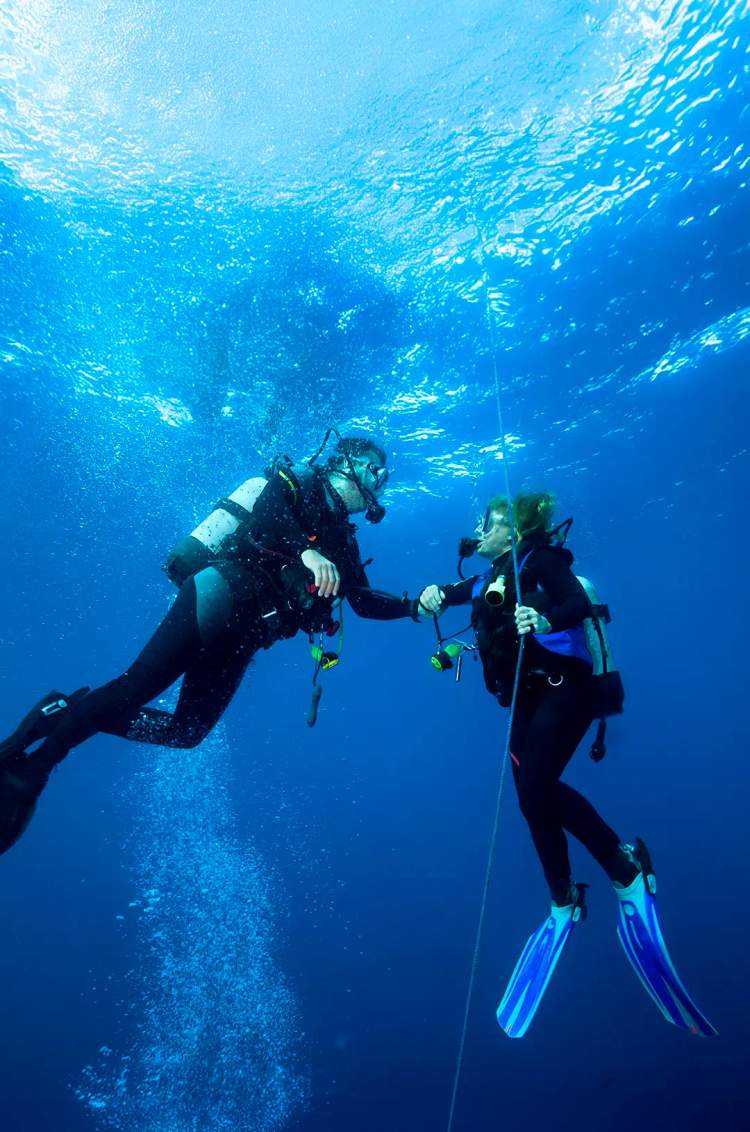 PADI instructor training student diver during Open Water certification dives in Puerto Vallarta