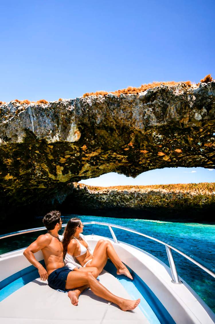 Couple exploring the famous Hidden Beach in the Marietas Islands on a private Punta Mita boat tour.