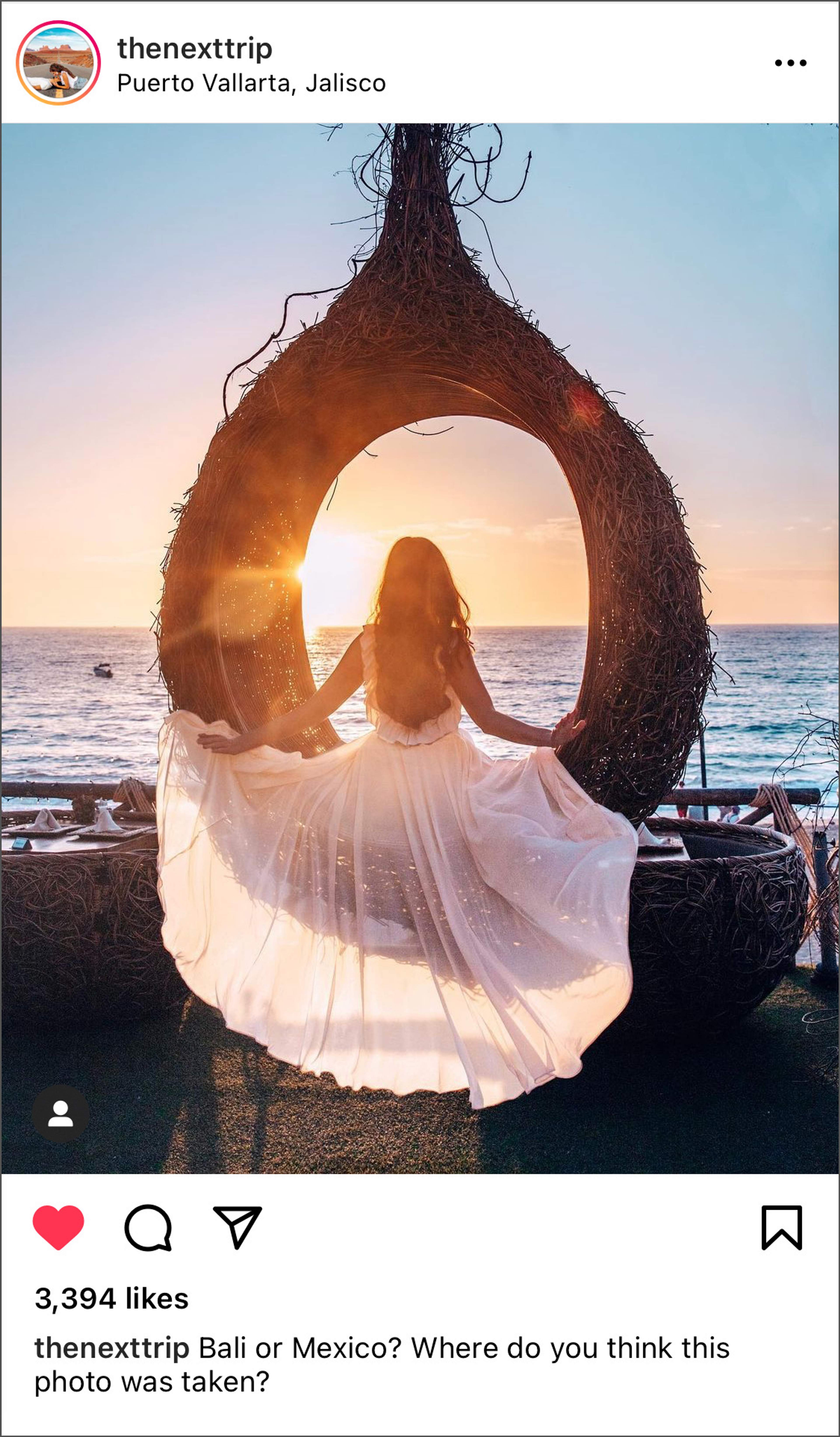 Woman in a flowing dress posing in a decorative nest swing at sunset in Puerto Vallarta, Jalisco.