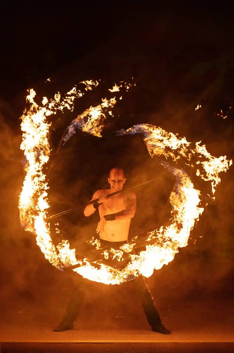 Fire dancer performing ritual choreography at ALMA, Rhythms of the Night – Premier in Puerto Vallarta