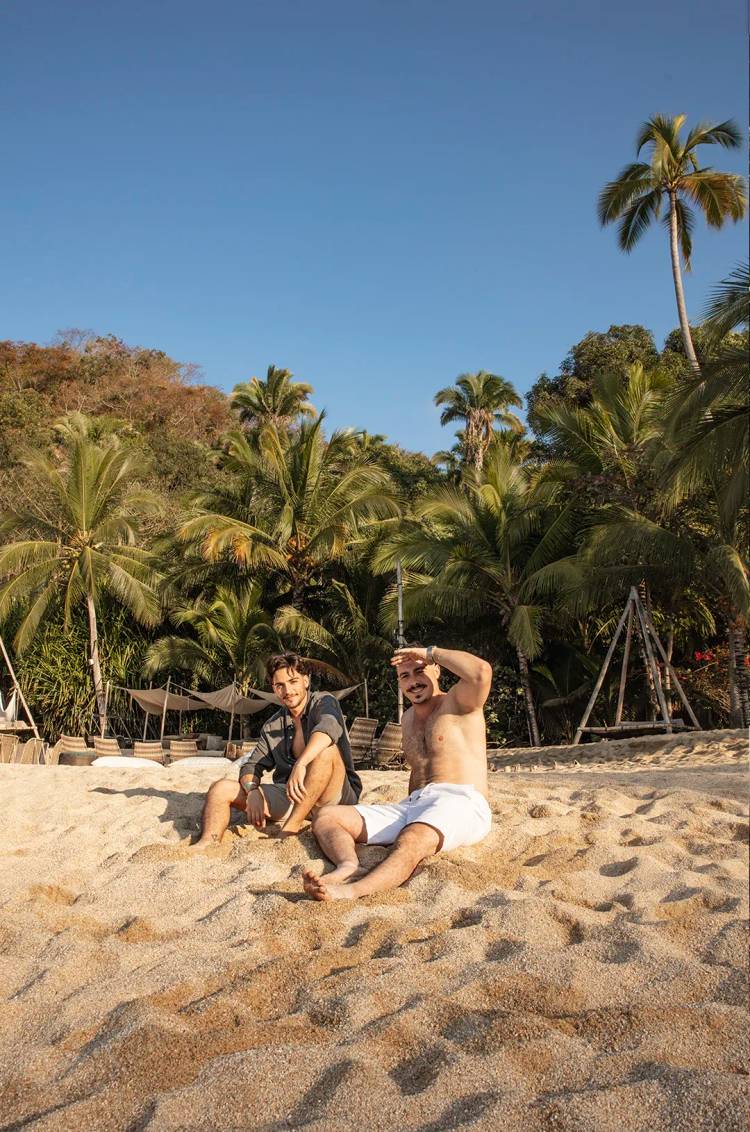 Friends relaxing and sunbathing on the beach at Majahuitas.